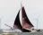 De EB50 aan de wind op het IJsselmeer met op de achtergrond de windmolens, die tussen Urk en Lemmer staan. (foto Ciska van Geer augustus 2020)